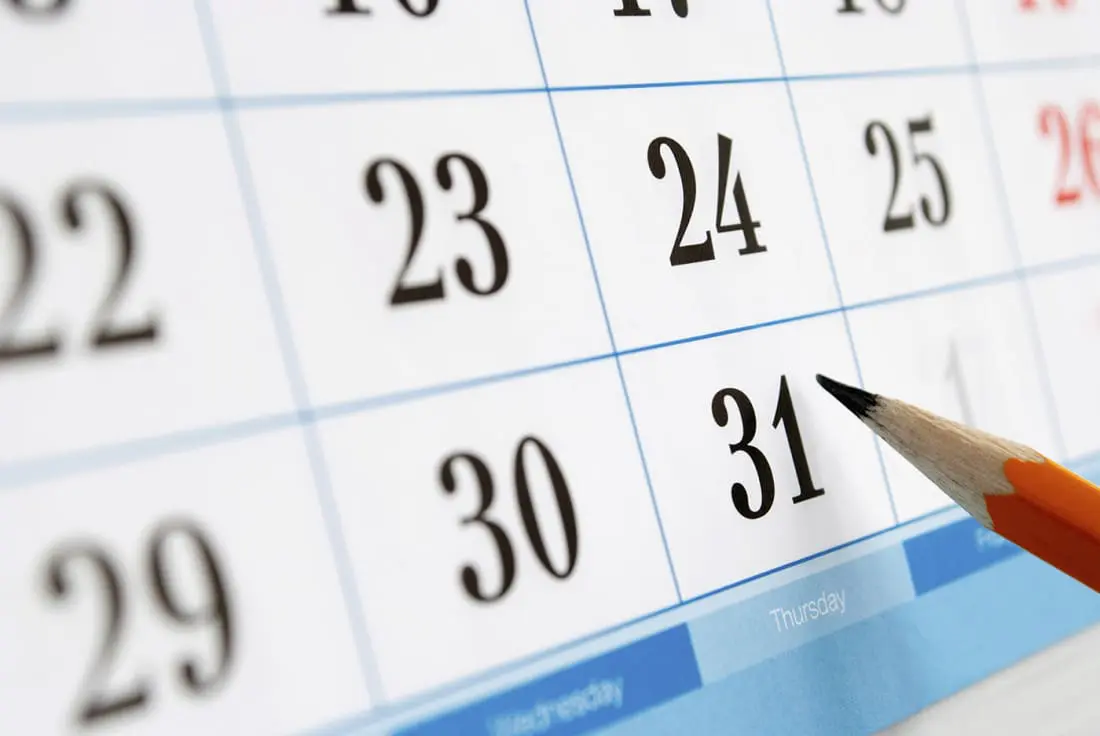 A close-up of a calendar page shows dates with a pencil pointing to the 31st.