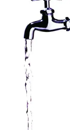 A stream of water flows from an open tap against a white background.