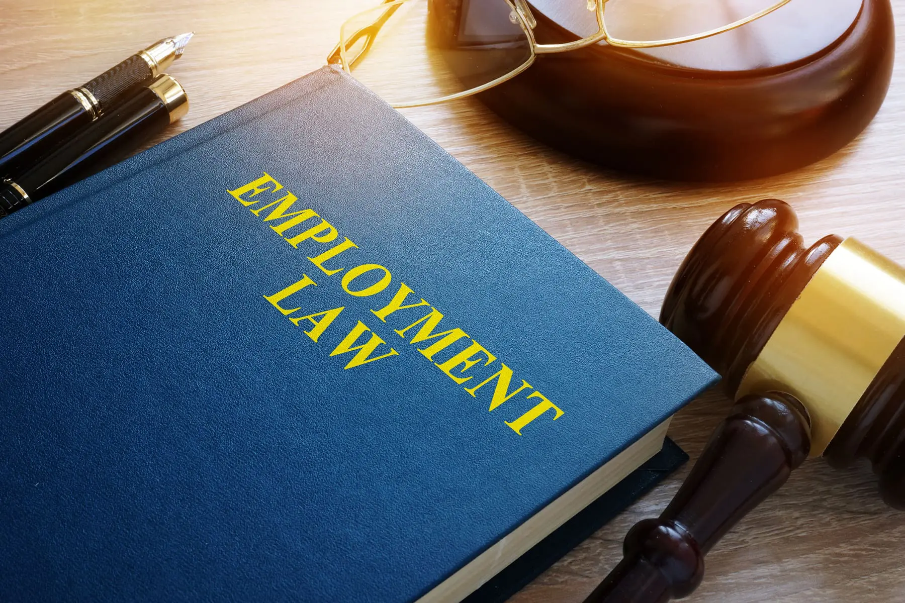 Employment Law Concept. Book And Gavel On A Desk.