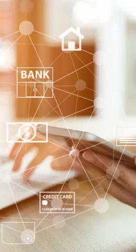 A person uses a smartphone with various finance-related icons floating around it, suggesting online banking.