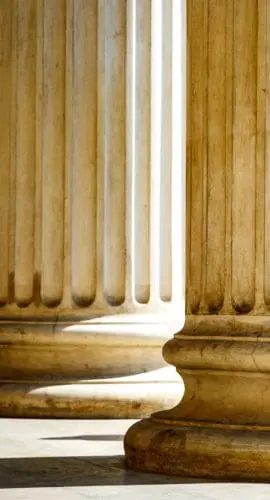 Columns with base and flute on a sun light.