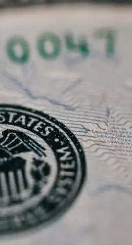 Symbol of eagle with shield on dollar banknote