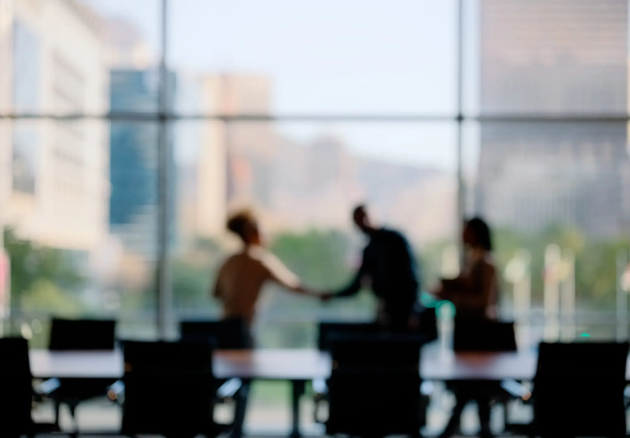 Business people, blur or shaking hands for deal, b2b collaboration or teamwork in office. Handshake, partnership or employee in corporate agreement with meeting success, welcome or thank you gesture